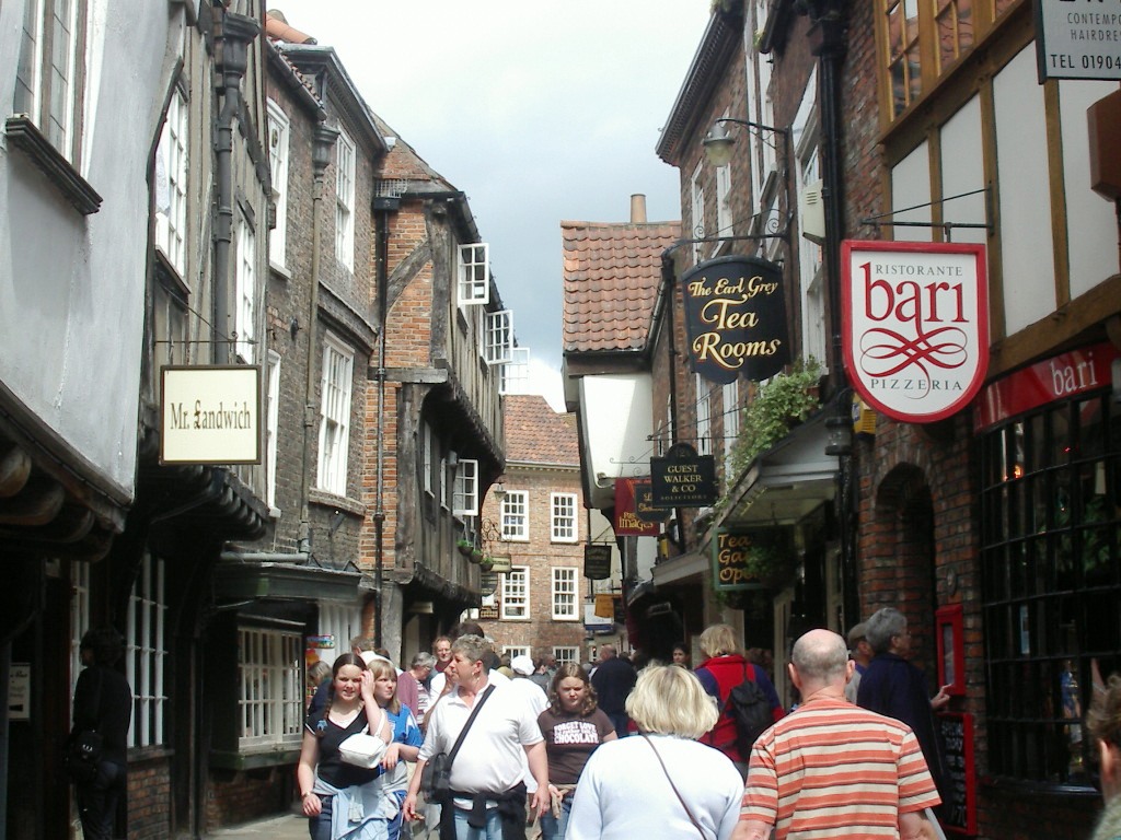 The Shambles in York — overhanging medieval timber-framed shopfronts on the narrow cobbled street
