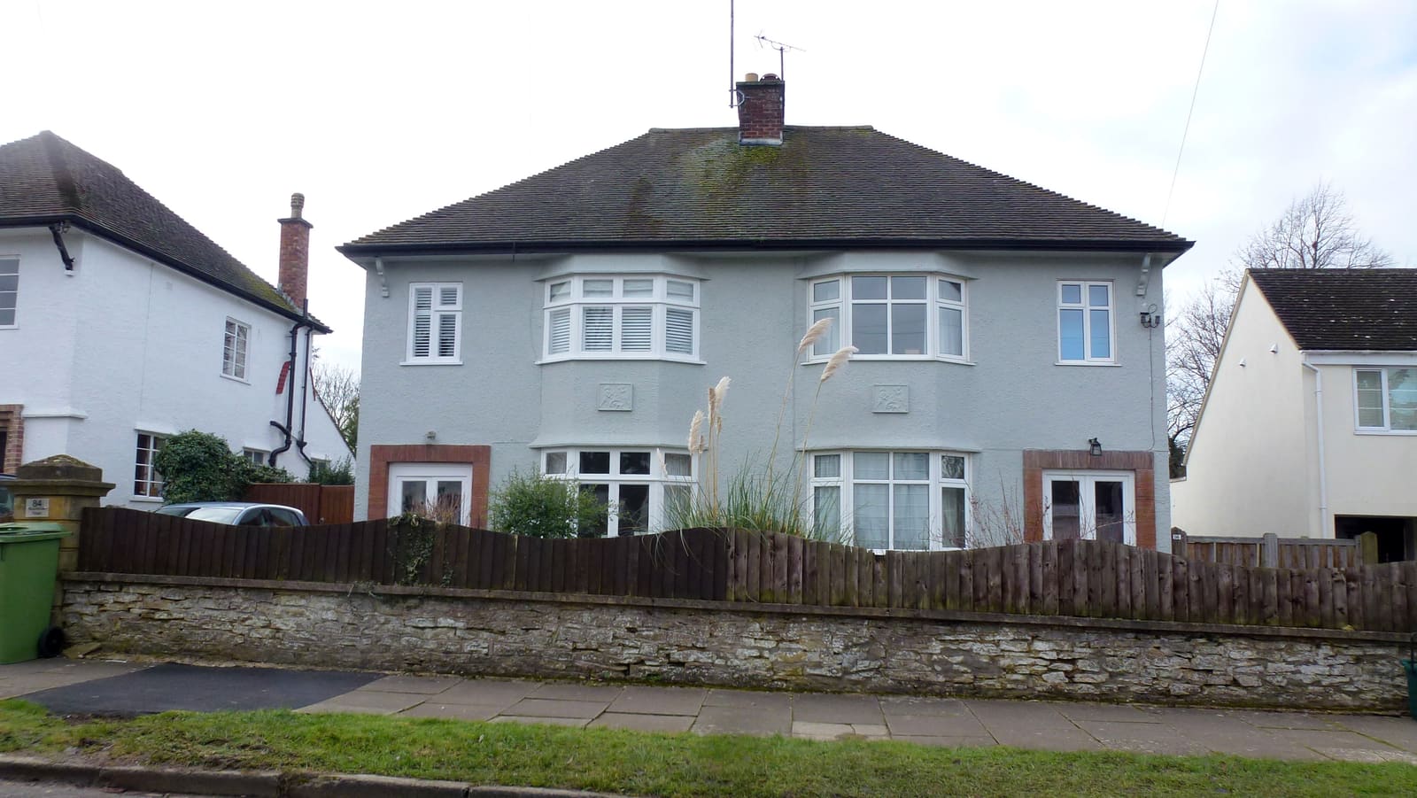 A pair of 1930s semi-detached houses in suburban Cheltenham