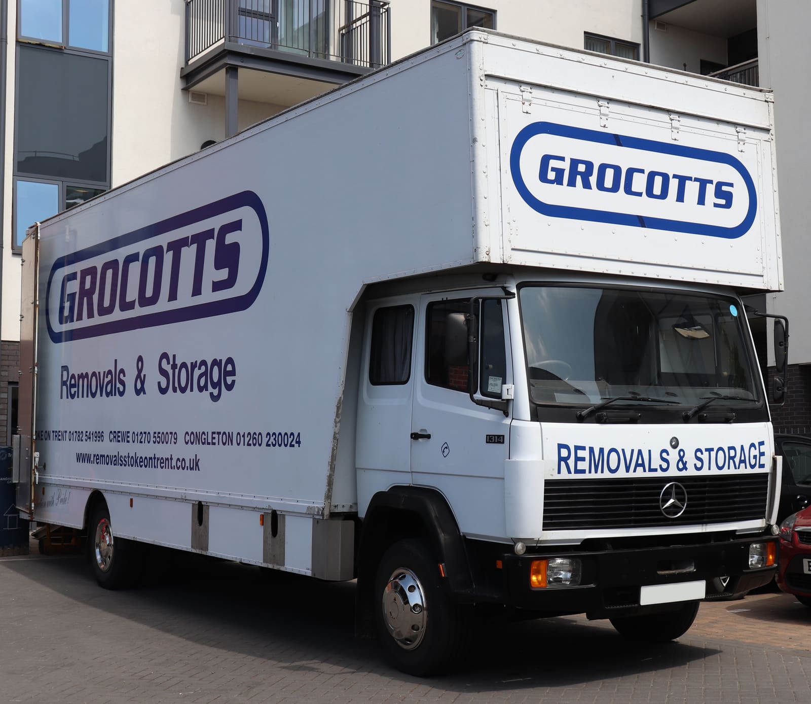 A removals lorry outside a block of flats